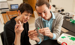 Prof. Susan Fahrbach in lab with David Hale