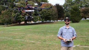 Max Messinger, graduate student and expert in research drones flys his "robot" on the WFU practice field